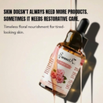 Swastik Rose Essential Oil bottle with soft pink floral label styled in warm luxury lighting for skin nourishment and radiant skincare rituals.
